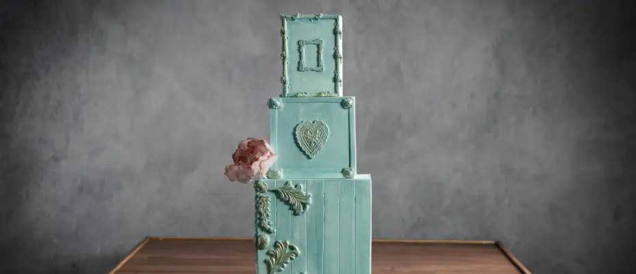 a romantic blue French-inspired wedding cake, a masterpiece of sophistication
